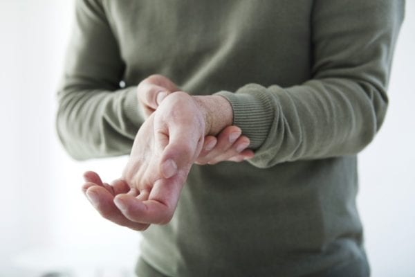 Man Experiencing Pain in his Wrists