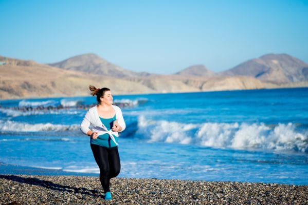 Plus Size Athlete Running on the Beach