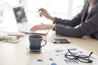 Woman at her computer typing away
