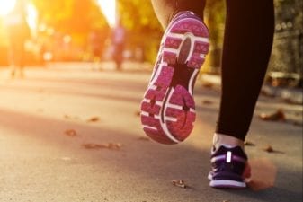 Women Athlete Jogging in a City Park