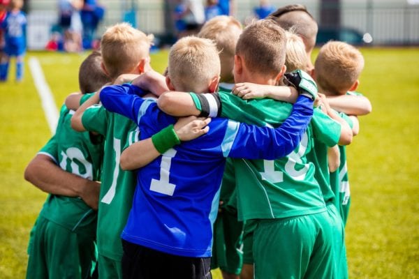 Boys Soccer Team Huddles During Halftime