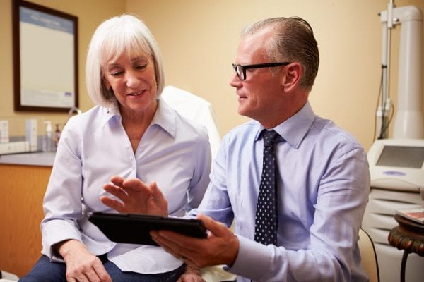 Doctor and patient talking through Lupus and Rhuematoid Arthritis
