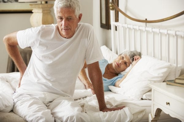 Man with lower back pain from sleeping
