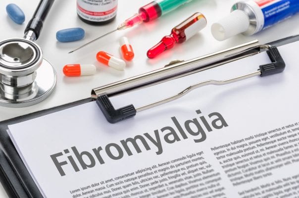 Doctors notepad with fibromyalgia written on it